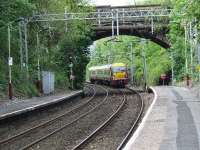 334014 approaching Cartsdyke with a service from Gourock bound for Glasgow Central<br><br>[Graham Morgan 23/05/2007]