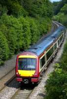 Falkirk Grahamston - Glasgow Queen Street service heads south near Cumbernauld.<br><br>[Bill Roberton /06/2007]