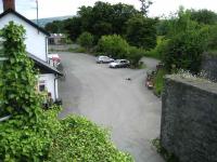 View over the former Cambrian station area at Builth Road from the end of the platform of the high level LNWR station. 020607.<br><br>[John McIntyre 02/06/2007]