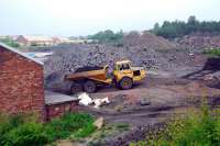 Something interesting happening at the site of the former NCB sidings at the Lady Victoria Colliery. View looks north-east and the Waverley route trackbed is beyond the building to the left.<br><br>[Ewan Crawford 09/06/2007]