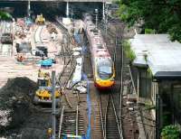 The 1010 Virgin Pendolino service to London Euston finds a way out of Waverley on 11 June 2007. The Pendolino arrived as the 0841 <I>local</I> from Carstairs, having run there empty from Glasgow Central to pick up Edinburgh passengers off the 0510 Manchester Piccadilly - Glasgow Central service.<br><br>[John Furnevel 11/06/2007]