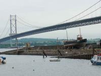 Forth Estuary railway pier (1878-1890). Connecting train ferry from here to Port Edgar. This facility was closed to railway traffic on the opening of the Forth Bridge. The Road Bridge towers above. [See image 33207]<br><br>[Brian Forbes 12/06/2007]