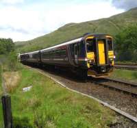 Northbound West Highland service passing the sidings at Glen Douglas on 28 May 2007.<br><br>[John McIntyre 28/05/2007]
