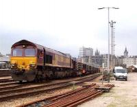 EWS 66 with a train of pipes in Guild Street yard, Aberdeen in June 2007. The south end of Aberdeen station can be seen in the left background. <br><br>[Mick Golightly /06/2007]