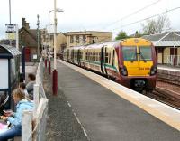 A Dalmuir train waiting to leave Lanark on 23 May 2007. Meantime, a young mystic at the bus stop appears to be doing leftover sandwich readings.<br><br>[John Furnevel 23/05/2007]