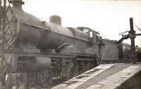 Glasgow - Stranraer express. Compound 1144 taking water at Girvan. Driver: Jimmy McCreadie. Fireman: John Shields.<br><br>[G H Robin collection by courtesy of the Mitchell Library, Glasgow /02/1941]