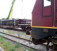 67011 stands patiently in Aberdeen Guild Street yard in May 2007 as a train of pipes is loaded. <br><br>[Mick Golightly /05/2007]