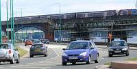 Riverside Drive is busy in June 2007 as this 6 car 170 slows for the ninety degree turn towards Dundee station.<br><br>[Brian Forbes 17/06/2007]