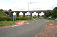 Cargenbridge Viaduct looking south east in May 2007. The trackbed is now fenced off at each end of the viaduct which is deemed a dangerous structure. The Maxwelltown Railway Path climbs up the embankment on the left and joins the old trackbed heading east towards Dumfries.<br><br>[John Furnevel 30/05/2007]