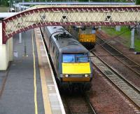 GNER Kings Cross - Glasgow Central service comes off the Edinburgh line and snakes through Carstairs on 24 May, passing a pair of class 86s on the Coatbridge containers held in the loop. <br><br>[John Furnevel 24/05/2007]