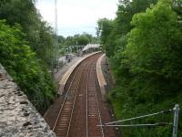 A quiet Sunday morning in June 2007 at Patterton station, looking east from the B769 roadbridge towards Whitecraigs.<br><br>[John Furnevel 17/06/2007]