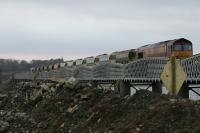 Ballast train waiting on the viaduct just south of Montrose station.<br><br>[Duncan Ross 02/03/2007]