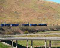 DRS 66 with the Tesco containers on Beattock Bank near Greskine in April 2007.<br><br>[John Furnevel /04/2007]