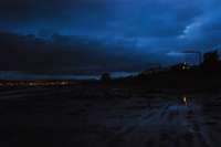 Sleeper heads east from Cardross on one of the longest days of the year with the lights of Greenock across the water.<br><br>[Ewan Crawford 24/06/2007]