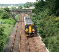 View west as a Waverley - Bathgate service runs towards its destination on 26 June 2007. On the left is the freight-only line from Carmondean Junction serving the STVA Bathgate Car Terminal.<br><br>[John Furnevel 26/06/2007]