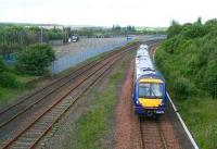 Edinburgh bound service leaving Bathgate on 26 June 2007 showing part of the huge area occupied by the Bathgate car compound.<br><br>[John Furnevel 26/06/2007]