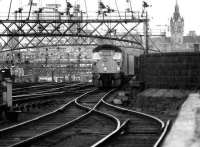 A class 26 takes a container train south out of Aberdeen in May 1975 while in the background a class 47 prepares to follow with a passenger train.<br><br>[John McIntyre /05/1975]