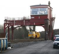 A tamper leaves the sidings and runs under the SB gantry at Hexham in May 2006 heading east towards Newcastle.<br><br>[John Furnevel 10/05/2006]