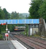 SPT 170 on the main line north of Dunblane awaiting the departure of an Edinburgh service. Then it will come through the crossover under the footbridge to reach Platform 1.<br><br>[Brian Forbes 30/06/2007]