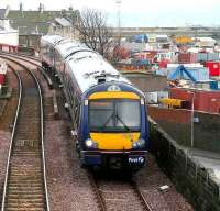 A southbound service leaving Burntisland in March 2007. In the background is Burntisland Harbour, part of which was used by the E&N train ferries that ran between Burntisland and Granton prior to the opening of The Forth Bridge in 1890. [See image 4002]<br><br>[John Furnevel 15/03/2007]