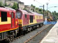 <h4><a href='/locations/E/Edinburgh_Waverley'>Edinburgh Waverley</a></h4><p><small><a href='/companies/N/North_British_Railway'>North British Railway</a></small></p><p><I>Excuse me - are you likely to be long...?</I> Sleeper locomotives 90018 and 67020 stuck in the east end bay following a problem on 5 July 2007.  41/42</p><p>05/07/2007<br><small><a href='/contributors/John_Furnevel'>John Furnevel</a></small></p>