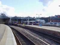 A busy evening at Inverness. L to R 170406 ready to leave for Glasgow. 158714 is going to Aberdeen. 170394 has just arrived and is masking 158719. Behind the photographer is the Caledonian Sleeper hauled by 67009.<br><br>[John Gray 08/07/2007]