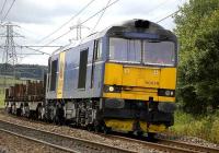 Blue liveried EWS 60078 near Curriehill on 10 July with the Dalziel-Lackenby steel empties.<br><br>[Bill Roberton 10/07/2007]