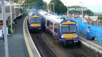 The 1910 Edinburgh-Aberdeen (left) accelerates away from Kinghorn Tunnel past the arriving 1941 Outer Circle service.<br><br>[Brian Forbes 09/07/2007]