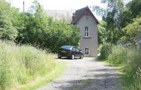 Approach road down from the A85 to the former station at Almondbank in July 2007. Immediately after running north east through the station the line passed below the main road (off picture to the left).<br><br>[John Furnevel 12/07/2007]