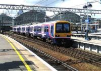 A 323 EMU about to leave Piccadilly on 22 May for Manchester Airport.<br><br>[John McIntyre 22/05/2007]