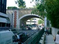 <B>Promenades  </B> des Plantes, some 4.5km long, part of former Paris-Strasbourg Railway. Photo shows bridge over Bvd. Diderot. The row of cycles parked are part of the new Velo Libre system, free use of thousands of bicycles available at one of 750 rental locations.<br><br>[Alistair MacKenzie 19/07/2007]