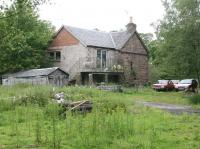 The former stationmaster's house at Alyth Junction in July 2007, looking from the goods yard... with a curious resident standing guard on the balcony.<br><br>[John Furnevel 12/07/2007]