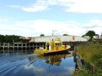 The Clachnaharry swing bridge opens to allow a small boat to start its journey to Fort William.<br><br>[John Gray 23/07/2007]