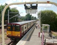 Glasgow bound train at Hillington East on 17 July.<br><br>[David Panton 17/07/2007]