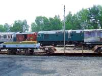 One of the Strathspey Railway Class 26 engines and other rolling stock at Boat Of Garten<br><br>[Graham Morgan 06/07/2007]