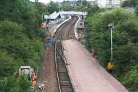 View south from Inverkeithing Central Junction on 24 July with the next ballast train waiting in the station.<br><br>[John Furnevel 24/07/2007]