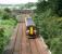 View west as a Waverley - Bathgate service runs towards its destination on 26 June 2007. On the left is the freight-only line from Carmondean Junction serving the STVA Bathgate Car Terminal.<br><br>[John Furnevel 26/06/2007]