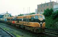 Freight passing the <I>Harp lager</I> brewery in Dundalk behind 141+186 in 1993.<br><br>[Bill Roberton //1993]