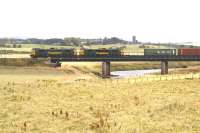 The regular pair of Freightliner class 86 locomotives takes the Coatbridge containers over the Clyde on 31 July on the southern approach to Carstairs.<br><br>[John Furnevel 31/07/2007]