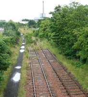 After WW1 Methil Docks became Scotlands chief coal port, exporting over 3m tons in 1923. The former lines to the docks are shown on 26 July 2007 looking east towards the now defunct Methil power station. <br><br>[John Furnevel 26/07/2007]