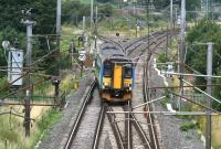 A mid morning Glasgow Central - Carlisle via Dumfries service comes off the G&SW route at Gretna Junction and crosses onto the up WCML on 3 August 2007. Unit 156403 is in Central Trains livery.<br><br>[John Furnevel 03/08/2007]