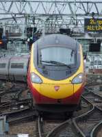 The rear of 390037 <i>Virgin Difference</i> as it departs from Glasgow Central<br><br>[Graham Morgan 23/06/2007]