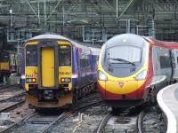 Glasgow Central with 156457 and 390050 <I>Virgin Invader</I>.<BR/><br><br>[Graham Morgan 23/06/2007]