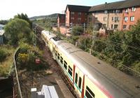 Early Sunday morning at Cartsdyke in July 2007, with a Glasgow bound train pulling away from the station. <br><br>[John Furnevel 29/07/2007]