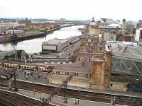 It's a long walk to the concourse from platform 11a at Glasgow Central, where passengers are seen disembarking from a class 334 EMU on 3 August 2007. Plans are currently in hand to realign and extend this short platform back into the station, following which it will handle trains operating on the planned Glasgow Airport Rail Link. Work on the required structural alterations is due to commence by mid 2009.<br><br>[Michael Gibb 03/08/2007]