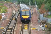 Good places not to have a points failure - no. 59 Polmont Junction. A Glasgow Queen Street - Edinburgh Waverley shuttle passing at speed on 7 August 2007.<br><br>[John Furnevel 07/08/2007]