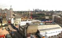 More cranes have appeared in the background as work on the new connection from Bishopsgate goods yard to Kingsland viaduct continues apace as part of the East London Line extension. Note the ex Tube stock bottom right in use as part of an arts centre.<br><br>[Michael Gibb 09/08/2007]