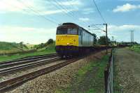 47386 takes a Permanent Way train south through Gretna Junction. The Dumfries route is off to the left.<br><br>[Ewan Crawford //1989]