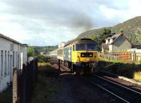 A class 47 takes an Inverness express north out of Aviemore in the late 80s.<br><br>[John McIntyre //1989]