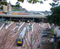 With engineering work ongoing and platform space at a premium, a First ScotRail arrival slowly approaches 14, where a Voyager has left just enough space.<br><br>[John Furnevel 17/08/2007]